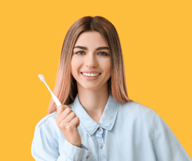 Smiling Woman Holding Toothbrush