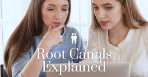 Two Women Looking at Laptop Root Canals Explained