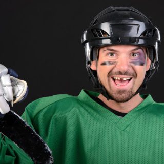 hockey player smiling with a missing tooth