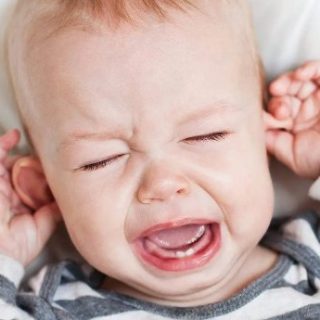 A teething child crying