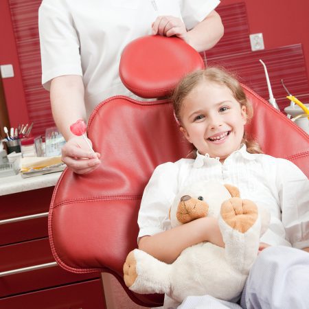 Young girl in a pediatric dental chair